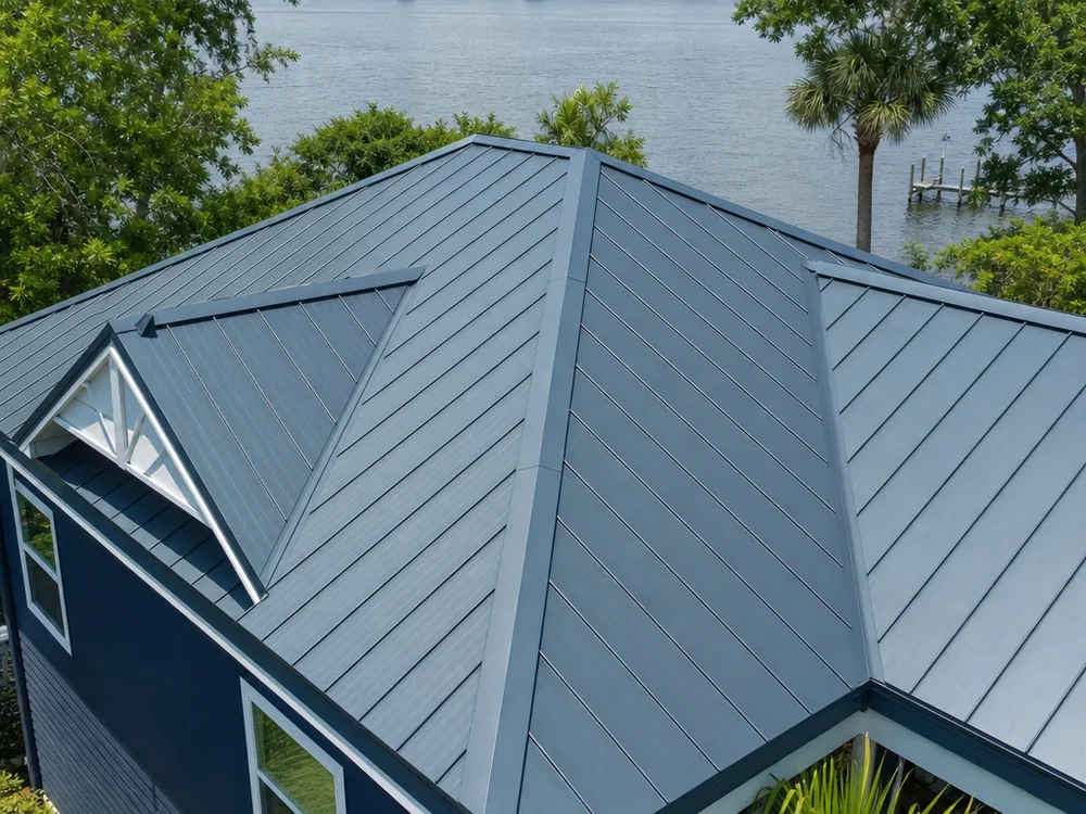 Finished standing seam roof ridge and hip intersections with clean matching trim